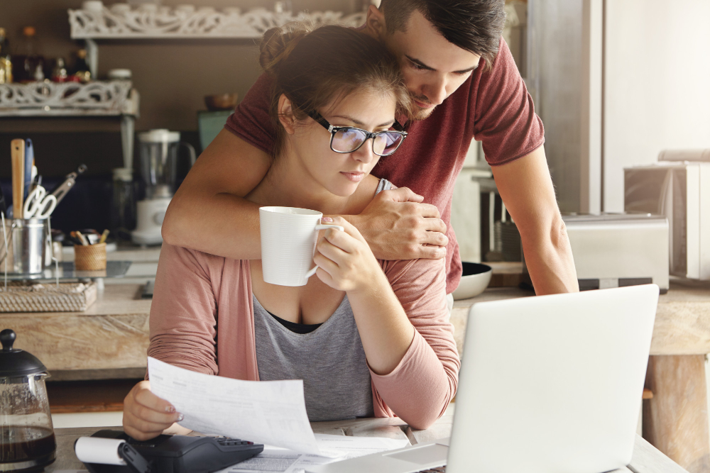 https://www.freepik.com/free-photo/indoor-shot-young-unhappy-caucasian-family-facing-financial-stress-beautiful-female-wearing-glasses-drinking-tea-while-doing-paperwork-with-her-husband-who-is-standing-embracing-her_9532810.htm